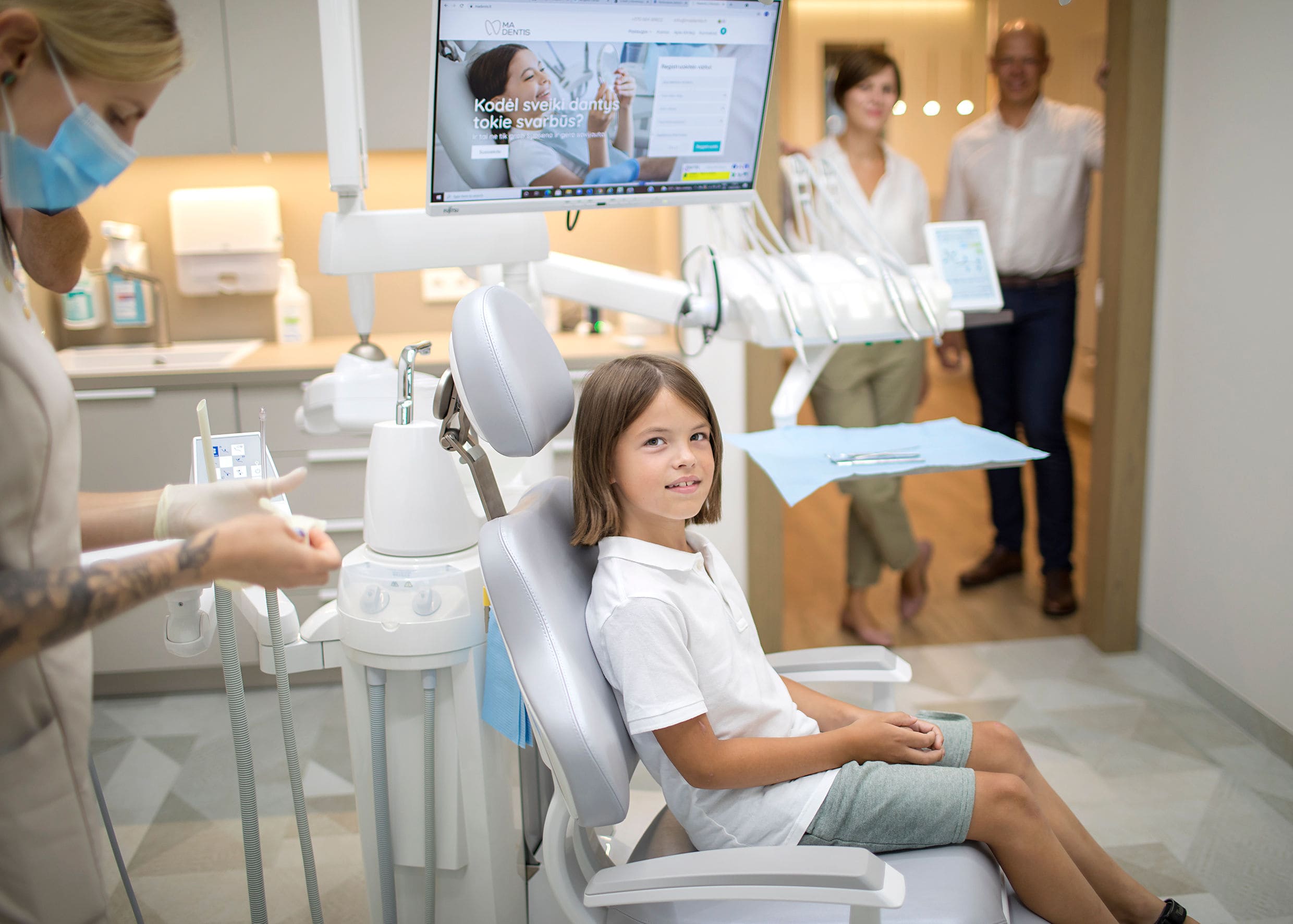 Vaikas odontologo kėdėje